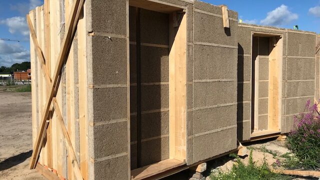Dun Agro prefabricated timber-framed hempcrete wall panel, serving as a monolithic, carbon-negative building envelope.