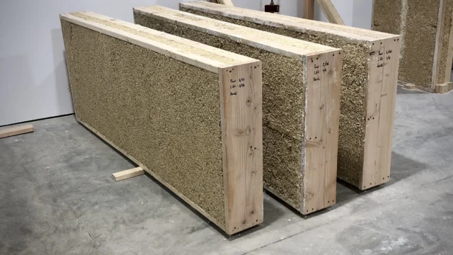 Dun Agro prefabricated timber-framed hempcrete wall panel, serving as a monolithic, carbon-negative building envelope.