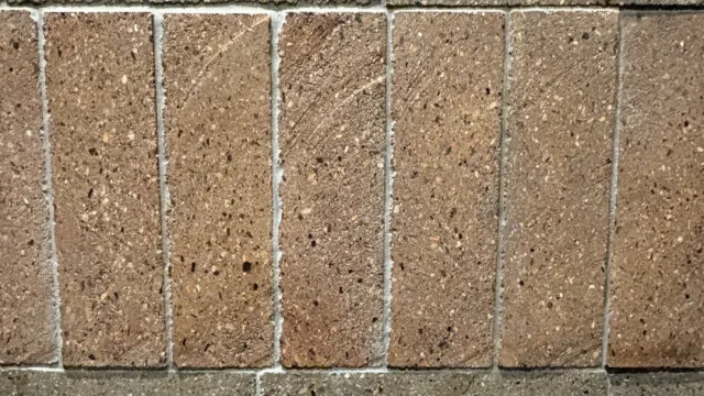 Exterior masonry facade built with Kenoteq K-Briq, an unfired brick made from 90 percent recycled construction waste.
