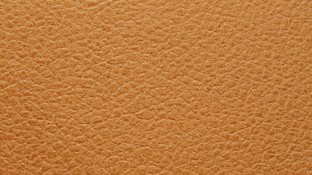 Pinatex-sustainable-leather-alternative-material-made-from-pineapple-leaf-fibers-showing-the-natural-texture-and-appearance-of-the-eco-friendly-fabric.png