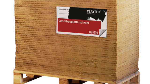 Claytec dry building boards installed on an interior stud frame, replacing traditional synthetic gypsum drywall with a raw earth bio-composite.