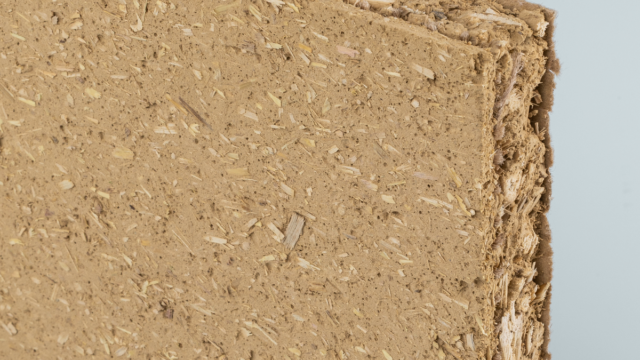 Claytec dry building boards installed on an interior stud frame, replacing traditional synthetic gypsum drywall with a raw earth bio-composite.